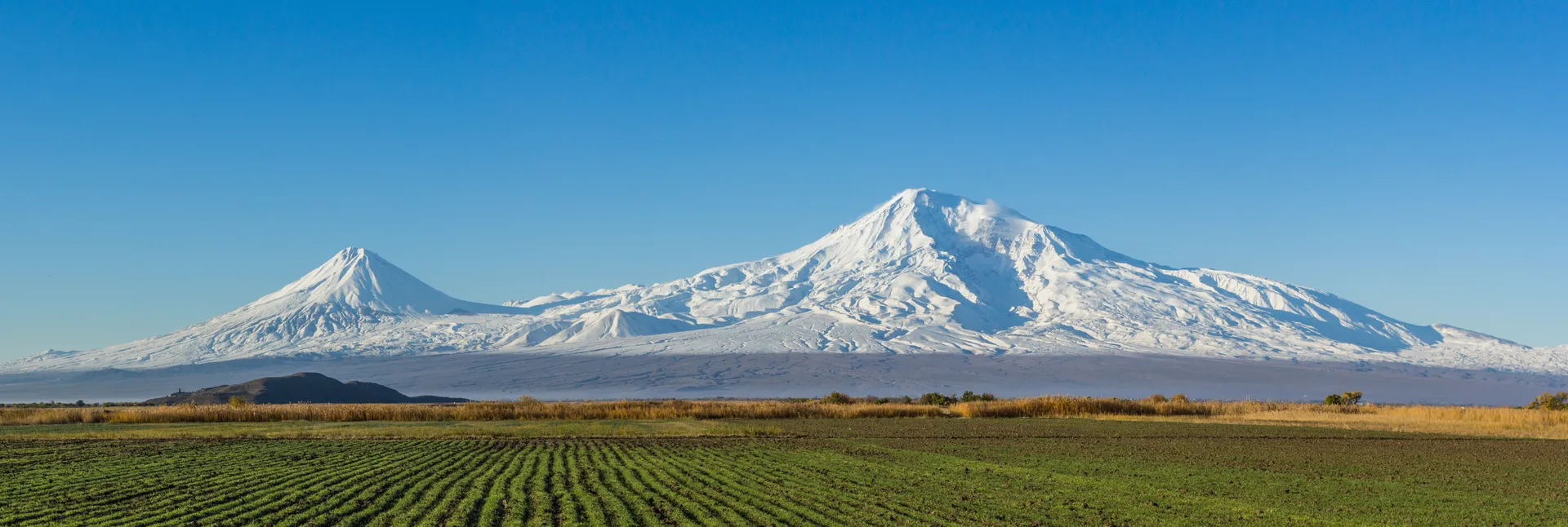 Mount Ararat rising over the Araratian plain at golden hour